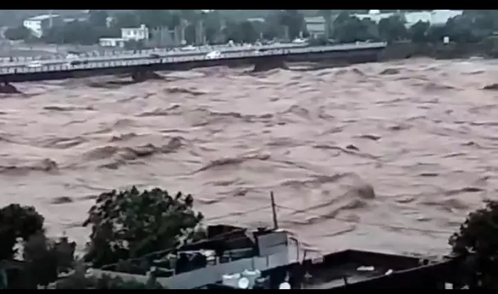 Tavi river flood with collapsed bridge in Jammu Kashmir during heavy rainfall